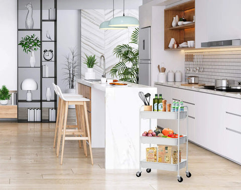 Kitchen view of Three Tier Rolling Metal Storage Organizer On Wheels White Mobile Utility Cart with caster wheels.