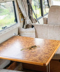 Beefy Heavy Duty Truck Trailer Gate Latch With Spring Toggle Clamp on RV table in cozy interior.