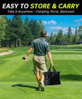 Person carrying Massive 6x6 Foot Golf Chipping Game Set With Adjustable Practice Clubs across a golf course
