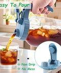 Two Pack 64 Oz Wide Mouth Pitchers With Stainless Steel Filters pouring iced tea into glass