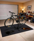 Oil Spill Mat For Driveway And Garage Floor 36x60 Heavy Duty Protector beneath bicycle in garage with oil stains