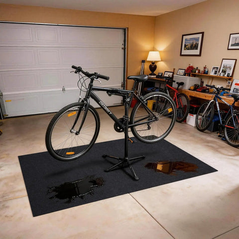 Oil Spill Mat For Driveway And Garage Floor 36x60 Heavy Duty Protector beneath bicycle in garage with oil stains