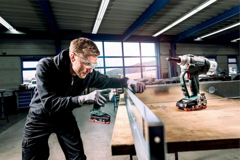 Tough As Nails Cordless Blind Rivet Gun With Brushless Motor delivers pneumatic pace in a workshop, used for precise metal joining.