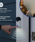 Wireless Security Doorbell Kit With Realistic Decoy Cam And Motion Activated Light, 150 Feet Range, 32 Chime Sounds And Four Volume Levels, White Easy Setup For Any Home Or Office, shown installed beside door with a person inside.