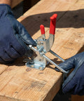 Person using 10 Pack Heavy Duty Toggle Latch Clamp 431 Type, 2000 Lbs Holding Capacity on wooden workbench in industrial setting