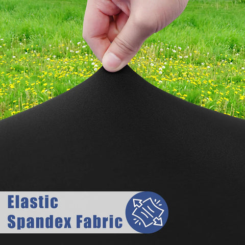 Hand stretching black Elastic Spandex Fabric with grassy field background, highlighting Round Spandex Tablecloth With Elastic Edge No Slip Waterproof Stretch Fit For 45 To 56 Inch Tables Ideal For Indoor Outdoor Dining And Camping Picnics Easy Care Washable Black.