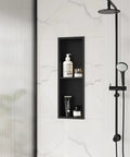 Stainless Steel Shower Niche 8 Inch By 24 Inch Recessed Wall Nook With Double Shelves No Tile Needed Matte Black Bathroom Storage Waterproof Built In Shelf Divider in a shower wall displaying bath products.