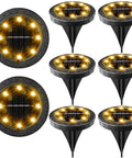Solar Powered Outdoor LED Disk Lights 8 Pack IP68 Waterproof Non Slip Wear Resistant Pathway Lights Warm White, front view