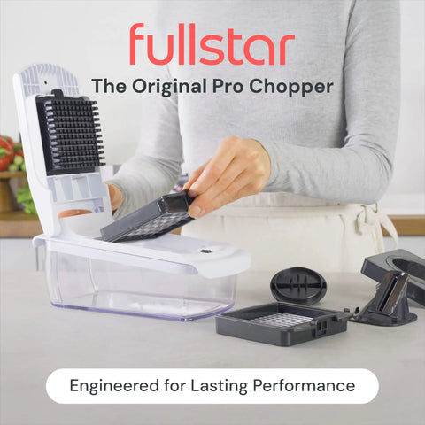 Must Have All In One Veggie Chopper With Spiralizer And Bowl Time Saving Food Chopper With Container Fruit Cutter And Onion Dicer 4 In 1 White Kitchen Gadget Great Gift Idea in use, showing replaceable blades on kitchen counter.