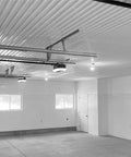 Interior view of a garage with white Trusscore Wall & Ceiling Board, showing trim and ceiling details for project planning.