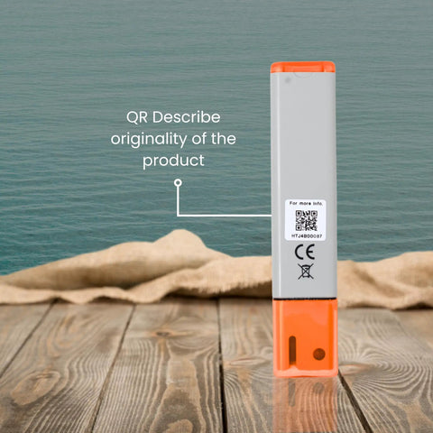 Back view of Pro Grade Digital pH and Temperature Meter With Auto Calibration on wooden surface, highlighting QR code.