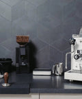 Next Level Home Bar Essentials Italian Handcrafted Espresso Machine With Heat Exchanger And E61 Manual Controls Badass Stainless Steel Chassis three liter tank fresh white finish on sleek kitchen counter.