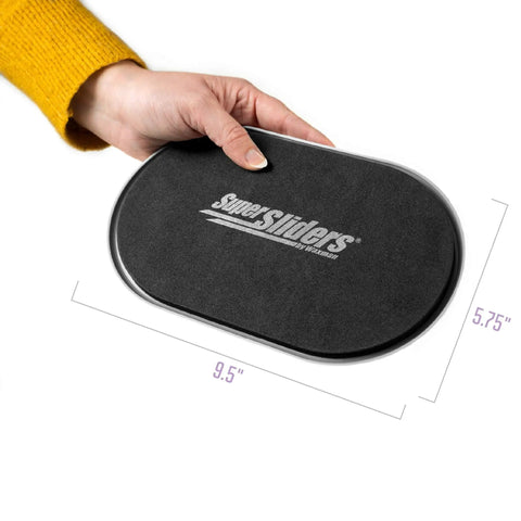 Hand holding Oval Five And Three Quarter Inch By Nine And A Half Inch Reusable Furniture Sliders For Carpet, Beige