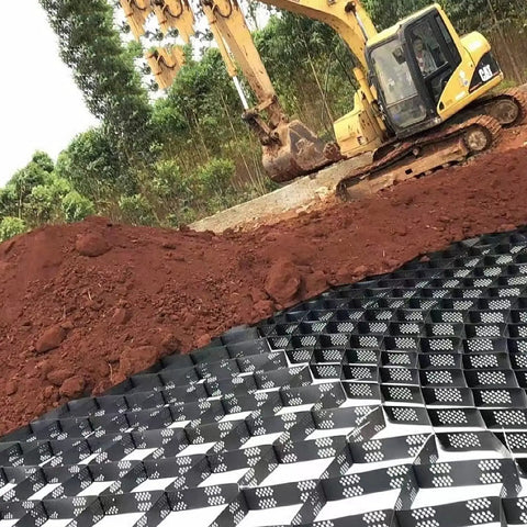 Heavy-Duty Gravel Grid Stabilizer For Driveways And Pathways installed on soil, durable honeycomb paver system, weather-resistant