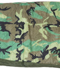Authentic US Military Poncho Liner Woobie Blanket Woodland M81 Camouflage shown flat with edge detail