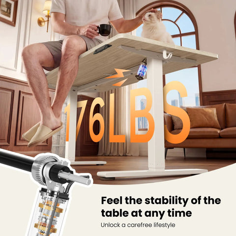Man sitting on Electric Height Adjustable Standing Desk 48 By 24 Inches With Smooth Lift From 28.3 To 46.5 Inches, holding a cup.