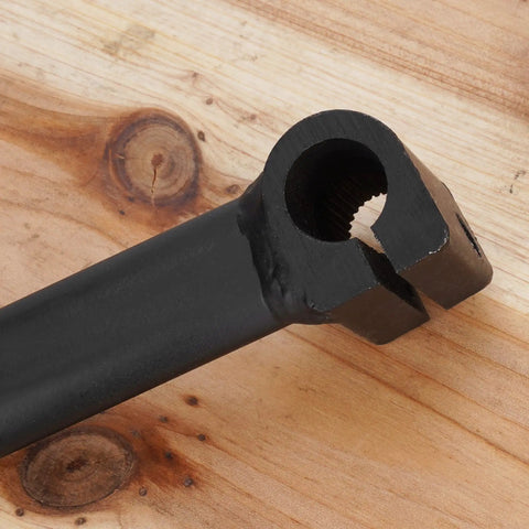 Close-up of black 135 Degree Universal Hand Gear Shifter Lever For ATVs And Quad Bikes, ergonomic design, wooden background.