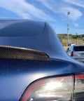 Real Molded Carbon Fiber Matte Dry Look Spoiler For Tesla Model 3 on a blue car, showcasing aerodynamics and sleek design.
