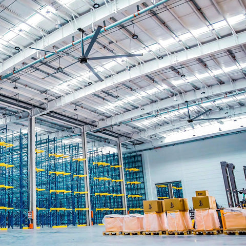 Image of Badass 20ft HVLS Industrial Ceiling Fan 208-240V 1-Phase With PMSM Drive System in a large warehouse.
