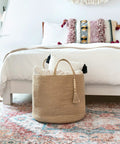 Woven Rope Storage Basket With Handles For Blankets, Toys, Clothes And Plants, Natural Jute Organizer Bin in bedroom setting