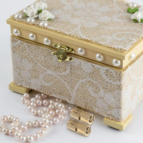 Decorative jewelry box with lace and pearls, featuring two Concealed Brass Barrel Hinges 8 Pack on a white surface.