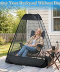 One Person Pop Up Mosquito Net Tent With Mesh Shelter, Instant No Fuss One Second Setup, in backyard with seated person.