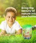 Child with Light Up Terrarium Kit For Kids A Fun Hands On STEM Science Toy, showing jar with LED glow, miniature garden inside.