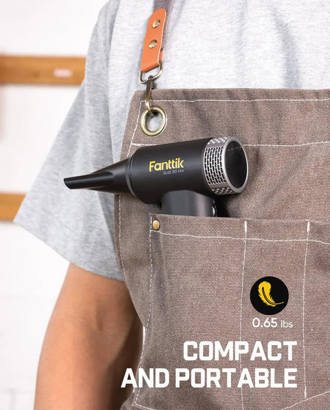 Gust B11 Mix 110000RPM Electric Air Duster And Portable Fan showing compact size in apron pocket, ideal for electronics.