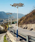 Tough As Nails Outdoor Solar Flood Lights With Smart Motion Sensor And Weatherproof Build That Lights Up Your Driveway Like Daylight, installed on road.
