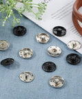 24 Sets Large Snaps For Sewing 25mm Aluminum Snap Buttons in silver and black on blue fabric background