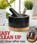 Heavy Duty 100 Percent Natural Granite Mortar And Pestle Set With Bamboo Base 2 Cup Capacity on kitchen counter