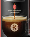 Crema Ready Single Serve Coffee Maker With Pressure Infusion For Rich Crema And Espresso Style Shots pouring espresso into cup
