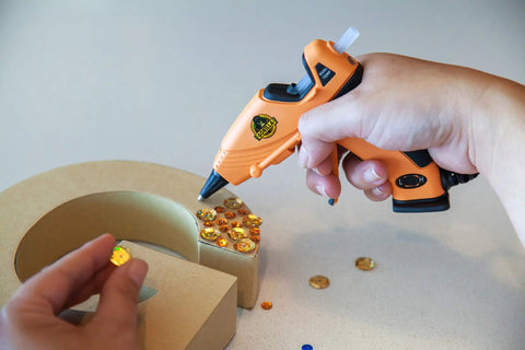 Using Clear Mini Hot Glue Sticks 4 Inch Long 0.27 Inch Diameter Pack Of 6 75 Count Per Pack for crafting with a glue gun