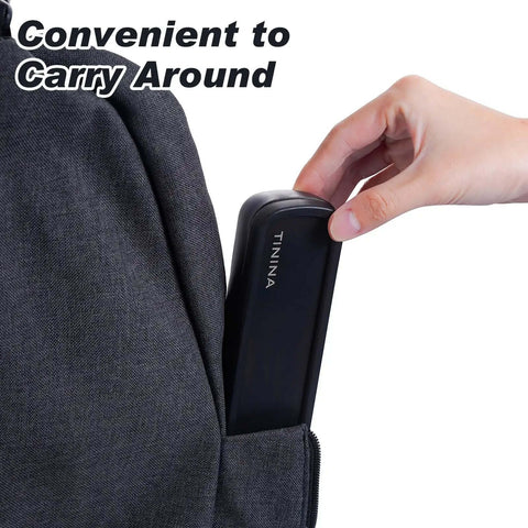 Hand placing Grab And Go 4 Piece Stainless Steel Travel Utensils Set With Reinforced Buckle Case in backpack pocket, black case.