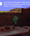 Green Neon Cactus Desk Light That Is Lit For Any Room on table, glowing in dark room, near window with cozy decor.