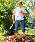 Person using adjustable leaf rake and 9 tine cultivator tool with 49 2 inch aluminum and rubber handle in garden