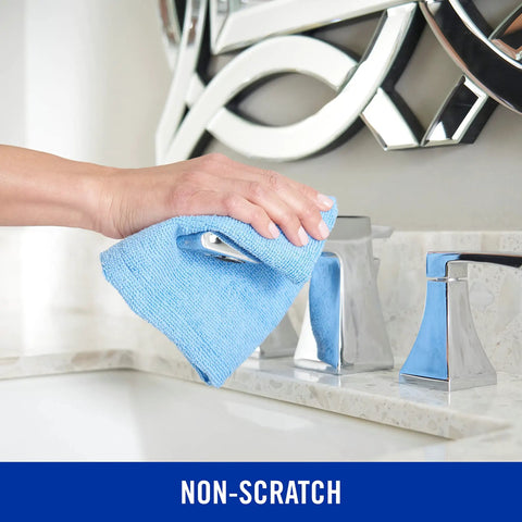 Hand using Microfiber Cleaning Cloth Bundle 14 By 14 Inches Blue Pack Of 24 Washable And Reusable for faucet cleaning