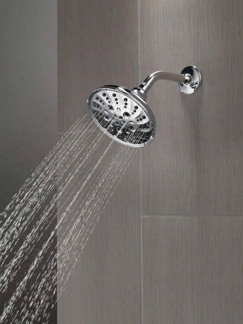 Mounted 5-Setting H2OKinetic Trad Raincan Shower Head in Matte Black spraying water, Easy Touch Clean spray holes visible.