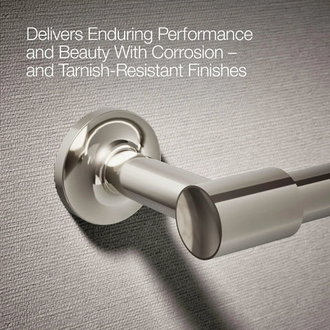 Close-up of Purist Pivoting Toilet Paper Holder in Vibrant Polished Nickel on wall, showing corrosion-resistant finish.