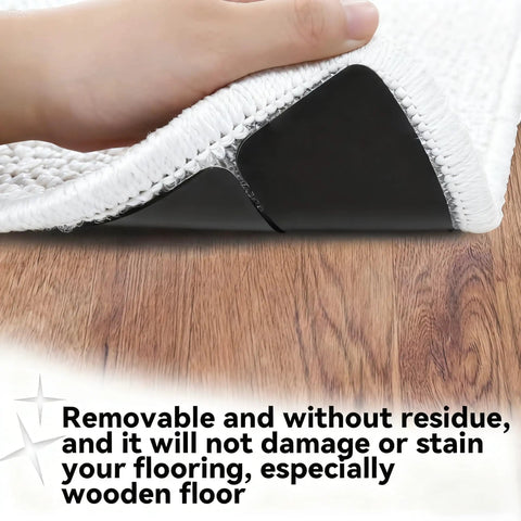 Hand lifting rug corner showing Non Slip Rug Grippers Set, Reusable Double Sided Carpet Tape Pads With Super Strong Adhesive For Area Rugs.