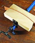 48 Inch Bar Clamps For Woodworking, lightweight aluminum, securing wooden panel on workbench, blue-black color, glue up ready