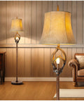 Cozy Farmhouse Vibe Antlers Floor Lamp With Night Light, Faux Leather Bell Shade, Brown Finish in a living room setting.