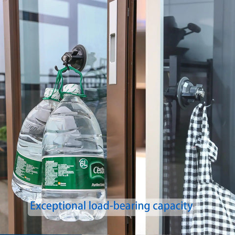 Heavy Duty Suction Cup Hook With Bombproof Grip For Window And Glass Walls featuring water bottles securely hanging on glass.