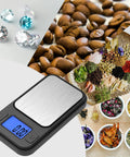 Ultra Precise 200G Milligram Scale With 0.01G Readout, black digital pocket scale with gems and herbs weighing.
