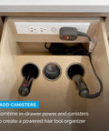 Retractable In Drawer Power Outlet With Four AC Outlets Brushed Stainless Steel mounted in drawer, showing organization for hair tools.