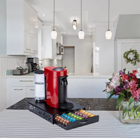 Kitchen scene with a red coffee maker on top of a Dope Metal Nespresso Pod Holder Drawer For Vertuo 50 Pod Capacity, black with capsules.
