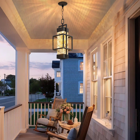 Built Like A Tank Modern Pendant Ceiling Light For Indoors Or Outdoors, Totally Waterproof Black Aluminum Porch Lantern Featuring Textured Water Ripple Glass, Includes Matching Bulb hanging over a porch, lighting a cozy seating area.