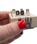 Hand holding Model Specific Infinite Control Switch Replacement For Electric Range Fits WB24T10058 WB24T10031 240V 15A 2600W Plug In Easy Install Heating Control Not Universal Stove Repair Part For Home Kitchens