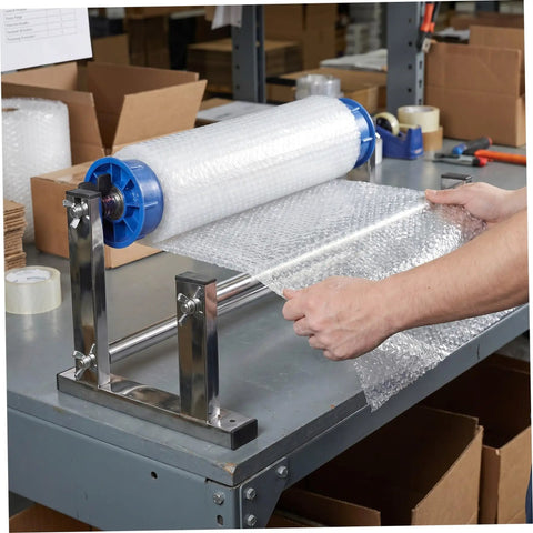 Manual Stretch Film Dispenser Stand For Shipping Supplies Hand Operated Wrap Film Holder With Metal And Plastic Construction Lightweight Yet Sturdy For Easy Desktop Wrapping And Efficient Warehouse Or Home Packing. Bubble wrap roll on metal stand used for packing