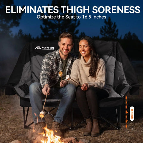 Couple roasting marshmallows on Two Person Low Seat Camping Couch Fully Padded Oversized Loveseat For Adults With Cup Holders And Carry Bag 650 Lb Capacity Black Built For All Day Comfort And Easy Chill At The Campground Or Backyard